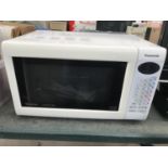 A PANASONIC MICROWAVE OVEN BELIEVED IN WORKING ORDER BUT NO WARRANTY