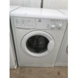 A WHITE INDESIT WASHING MACHINE BELIEVED IN WORKING ORDER BUT NO WARRANTY