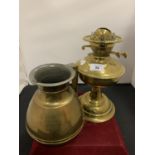 A LARGE BRASS JUG AND A BRASS OIL LAMP BASE BOTH MARKED TO BASE
