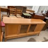 A BEECH SIDEBOARD WITH FOUR DOORS AND FOUR DRAWERS