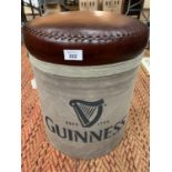 A FAUX LEATHER SEATED GUINNESS STOOL