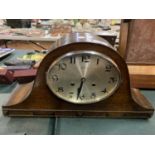 A LARGE OAK NAPOLEON'S HAT CHIMING MANTEL CLOCK