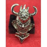 A LARGE WHITE METAL SAMURI WARRIOR STYLE RING