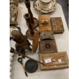 AN ASSORTMENT OF TREEN TO INCLUDE A TRIBAL FIGURE AND A PAIR OF CANDLESTICKS ETC