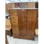 A CAMPAIGN STYLE MAHOGANY WARDROBE WITH RECESSED BRASS HANDLES AND CORNER PROTECTORS, TWO DOORS,