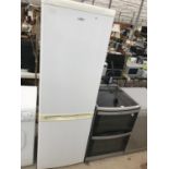 A TALL WHITE LOGIK UPRIGHT FRIDGE FREEZER BELIEVED IN WORKING ORDER BUT NO WARRANTY