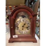 A KIENINGER ROLLING MOON MANTEL CLOCK