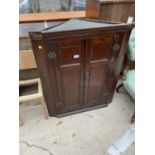 AN 18TH CENTURY OAK CORNER CUPBOARD WITH TWO PANELLED DOORS, 31" WIDE