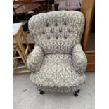 A LADIES' ARMCHAIR ON CABRIOLE SUPPORTS