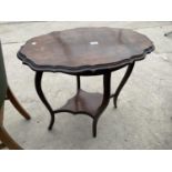 AN EDWARDIAN OVAL MAHOGANY TWO TIER OCCASIONAL TABLE