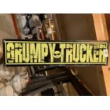 A METAL 'GRUMPY TRUCKER' MAN CAVE SIGN