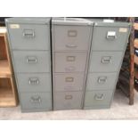 THREE METAL FOUR DRAWER FILING CABINETS