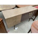 A 1960'S WOOD EFFECT MELAMINE SIDEBAORD ENCLOSING TWO CUPBOARDS AND THREE DRAWERS, 60" WIDE