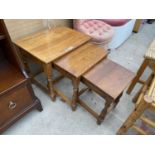 AN OAK NEST OF THREE TABLES