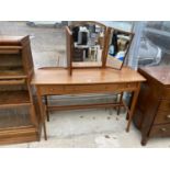 A MID 20TH CENTURY TEAK AND INLAID TRIPLE MIRROR DRESSING TABLE WITH TWO SHORT AND ONE LONG FRIEZE