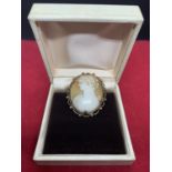 A CAMEO BROOCH WITH A 9 CARAT GOLD PLATED SURROUND