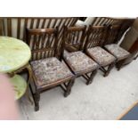 A SET OF FOUR OAK DINING CHAIRS