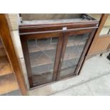 AN EARLY 20TH CENTURY OAK GLAZED AND LEADED BOOKCASE, TOP 31.5" WIDE
