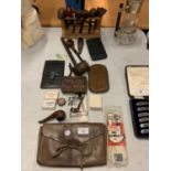 AN ASSORTMENT OF PIPE SMOKING ITEMS TO INCLUDE LEATHER TOBACCO POUCHES AND A PIPE STAND
