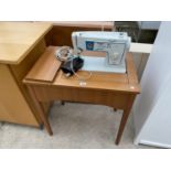 A SINGER 416 ELECTRIC SEWING MACHINE ON FREE STANDING TABLE
