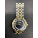 A LADIES FASHION WATCH WITH DIAMANTE FACE