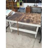 A LARGE VINTAGE WOODEN TABLE