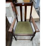 AN EARLY 20TH CENTURY OAK CARVER CHAIR ON BARLEYTWIST FRONT LEGS