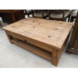 A PINE COFFEE TABLE WITH METAL STUDS, 47x32"