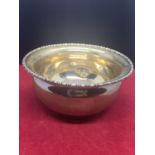 A HALLMARKED LONDON 1917 SILVER BOWL - 5.5 CM HIGH - MAKER FULLERTON (SOME SMALL INDENTATIONS)