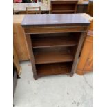 AN INLAID MAHOGANY THREE TIER BOOKCASE