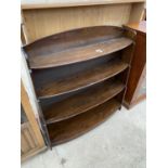 AN OAK BOW FRONT FOUR TIER BOOKCASE