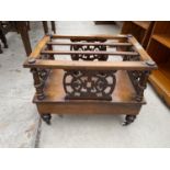 A VICTORIAN MAHOGANY CANTERBURY STYLE MAGAZINE RACK ON POT CASTERS WITH SINGLE DRAWER AND DECORATIVE