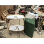 A LLOYD LOOM CORNER LAUNDRY BASKET WITH TWO DINNER TRAYS