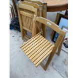 FOUR FOLDING SLATTED WOODEN CHAIRS