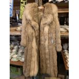 A VINTAGE 'MISTER MONTY' WOLF FUR LADIES COAT TO INCLUDE VALUATION RECIEPT