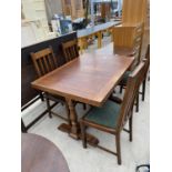 AN OAK DRAW LEAF DINING TABLE AND FOUR OAK DINING CHAIRS