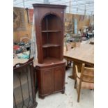 A MAHOGANY CORNER CABINET WITH LOWER DOOR AND UPPER SHELVING