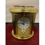 A GILT BRASS SWISS MADE MATTHEW NORMAN CARRIAGE CLOCK