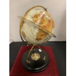 A GLOBE MOUNTED ON A WOODEN PLINTH INCORPORATING A COMPASS