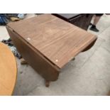 A MAHOGANY DROP LEAF DINING TABLE OF MAHOGANY TRIPOD SUPPORT