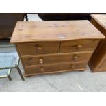 A PINE CHEST OF TWO SHORT AND TWO LONG DRAWERS