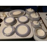 A BLUE AND WHITE GEM DINNER SERVICE MADE IN ENGLAND TO INCLUDE TUREENS ETC