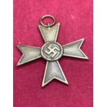 A BRASS MEDAL WITH SWASTIKA AND 1939 TO REVERSE