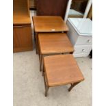 A RETRO TEAK NEST OF THREE TABLES