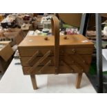 A RETRO WOODEN CANTILEVER SEWING BOX TO INCLUDE CONTENTS