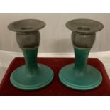 A PAIR OF 1930'S PILKINGTONS LANCASTRIAN POTTERY GREEN BASED CANDLESTICKS WITH TWO PIECE HAMMERED