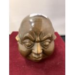 A BRASS FOUR FACED BUDDHA'S HEAD