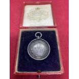 A BIRMINGHAM HALLMARKED SILVER 1911 MEDAL DERBY AND DISTRICT SWIMMING AND LIFE SAVING ASSOCIATION IN