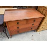 AN OAK CHEST OF TWO SHORT AND TWO LONG DRAWERS