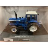 A BOXED UNIVERSAL HOBBIES DIE CAST FORD TRACTOR 1:32